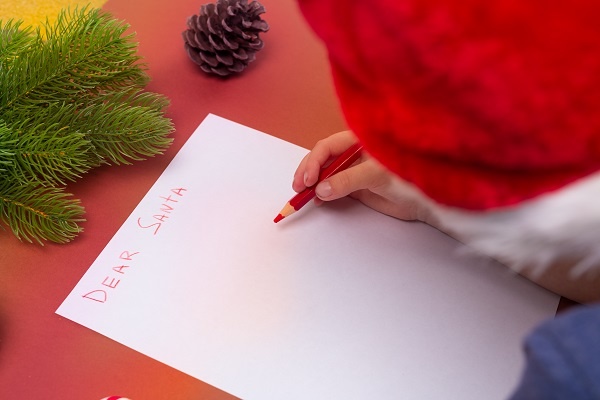 Little Boy With Santa Hat Writing Letter To Santa 1235751136 Little Boy With Santa Hat Writing Letter To Santa 1235751136