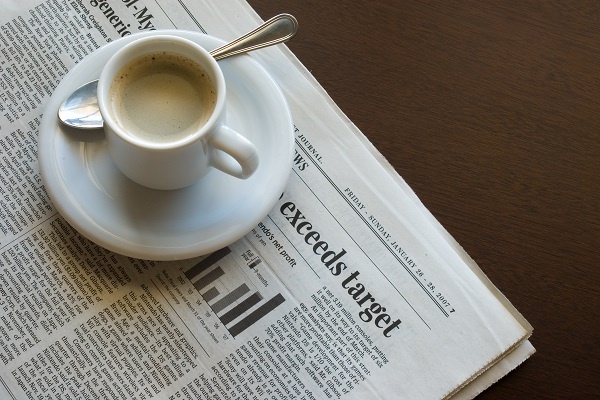 Event Meeting Newspaper With Coffee Cup Sitting On It 1 Event Meeting Newspaper With Coffee Cup Sitting On It 1